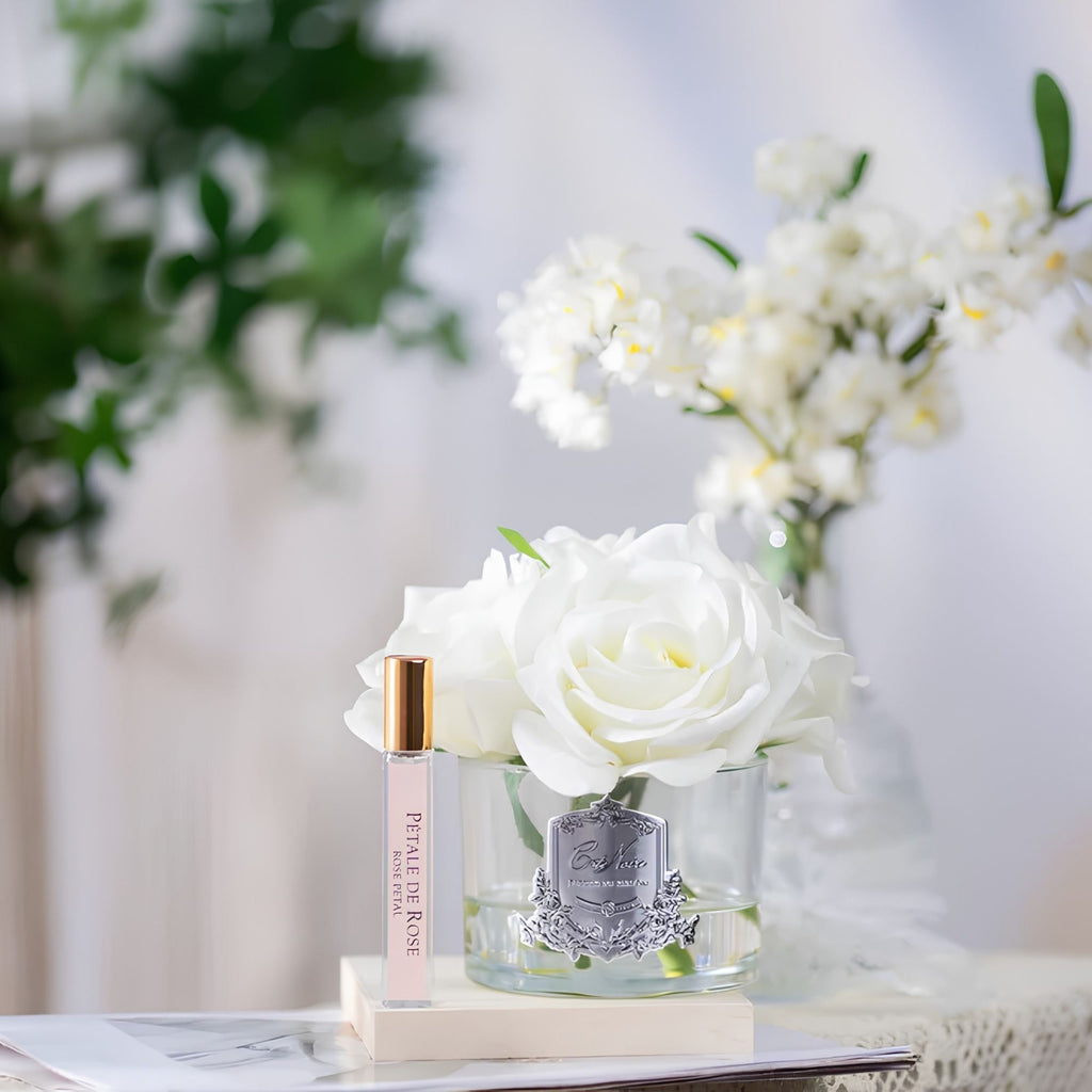 Close-up of Côte Noire Ivory Five Roses petals in gel with silver crest detail