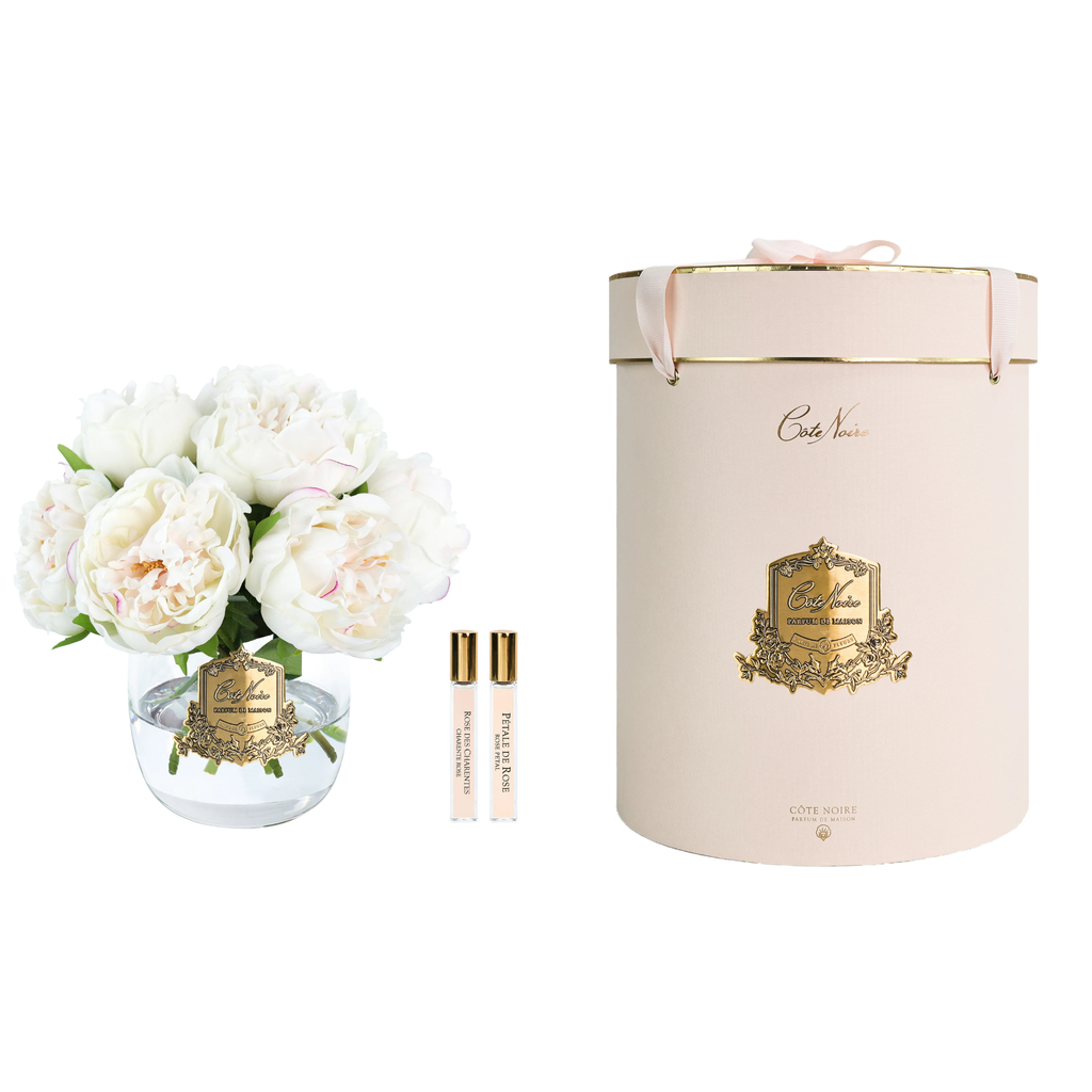 Côte Noire Heritage Peonies Bouquet in Blush displayed in a luxury glass vase with signature gold badge