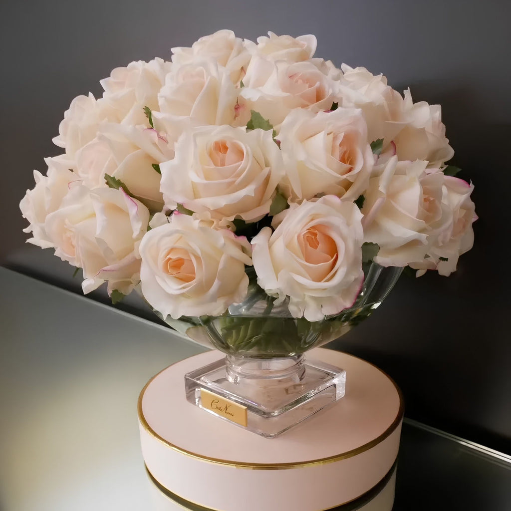 Close-up of Côte Noire Luxury Centrepiece Pink Blush rose buds in crystal-clear gel with gold badge detail