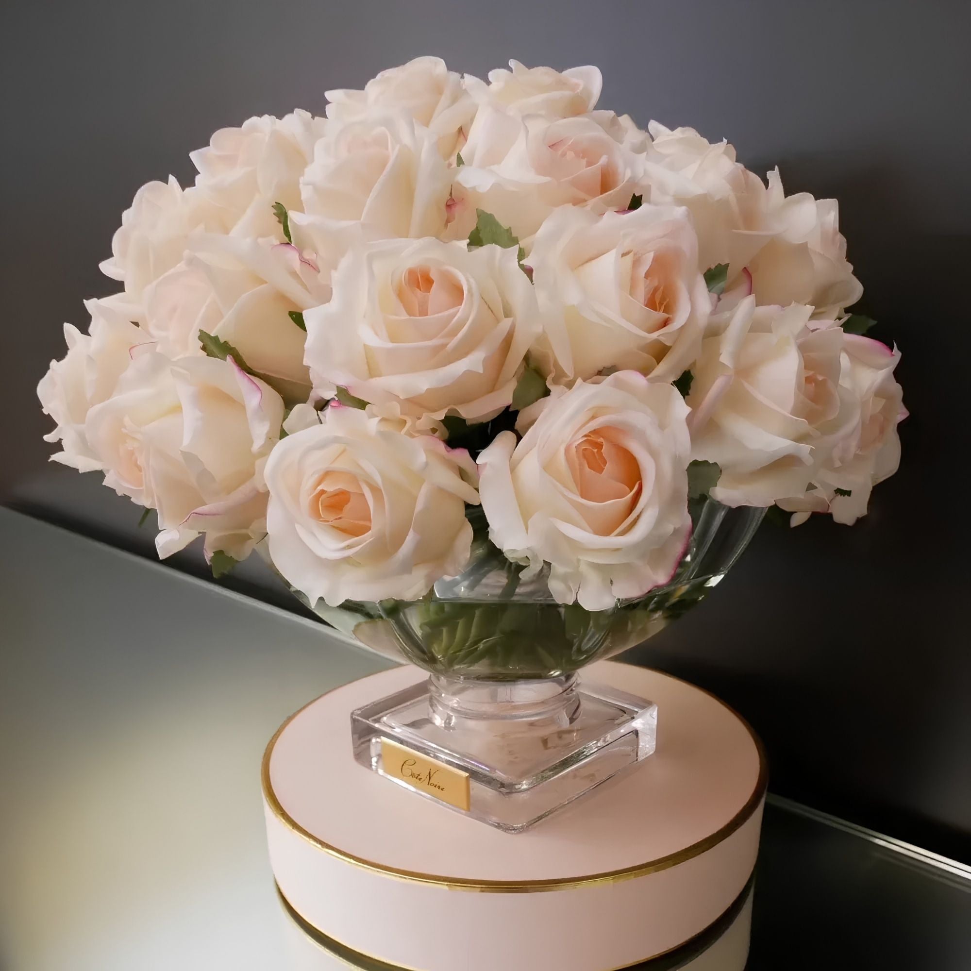Close-up of Côte Noire Luxury Centrepiece Pink Blush rose buds in crystal-clear gel with gold badge detail