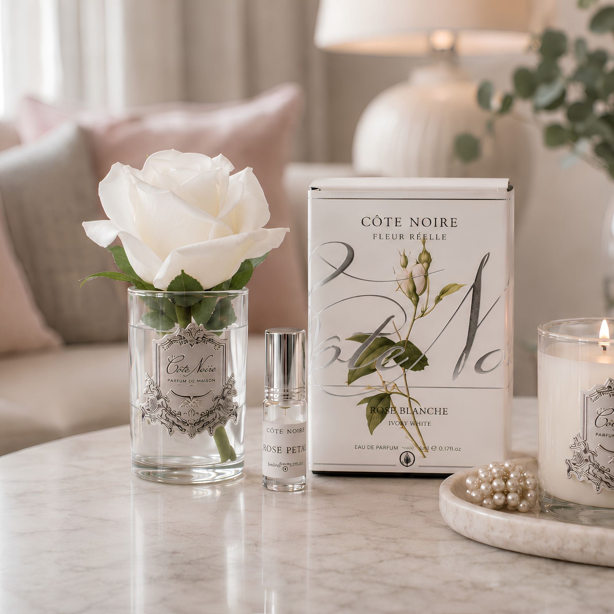 Close-up of Côte Noire Ivory White Rose Bud petals in gel with silver crest detail