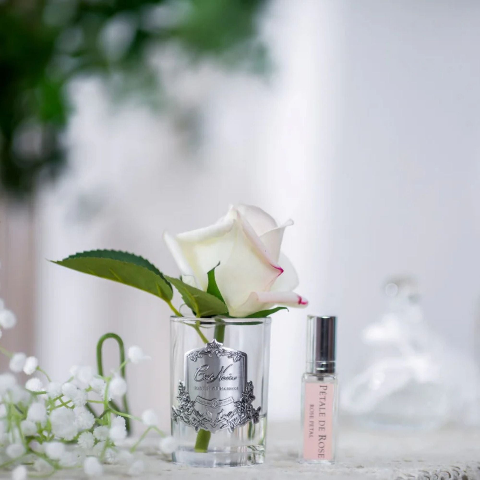 Close-up of Côte Noire Pink Blush Rose Bud petals in gel with silver crest detail