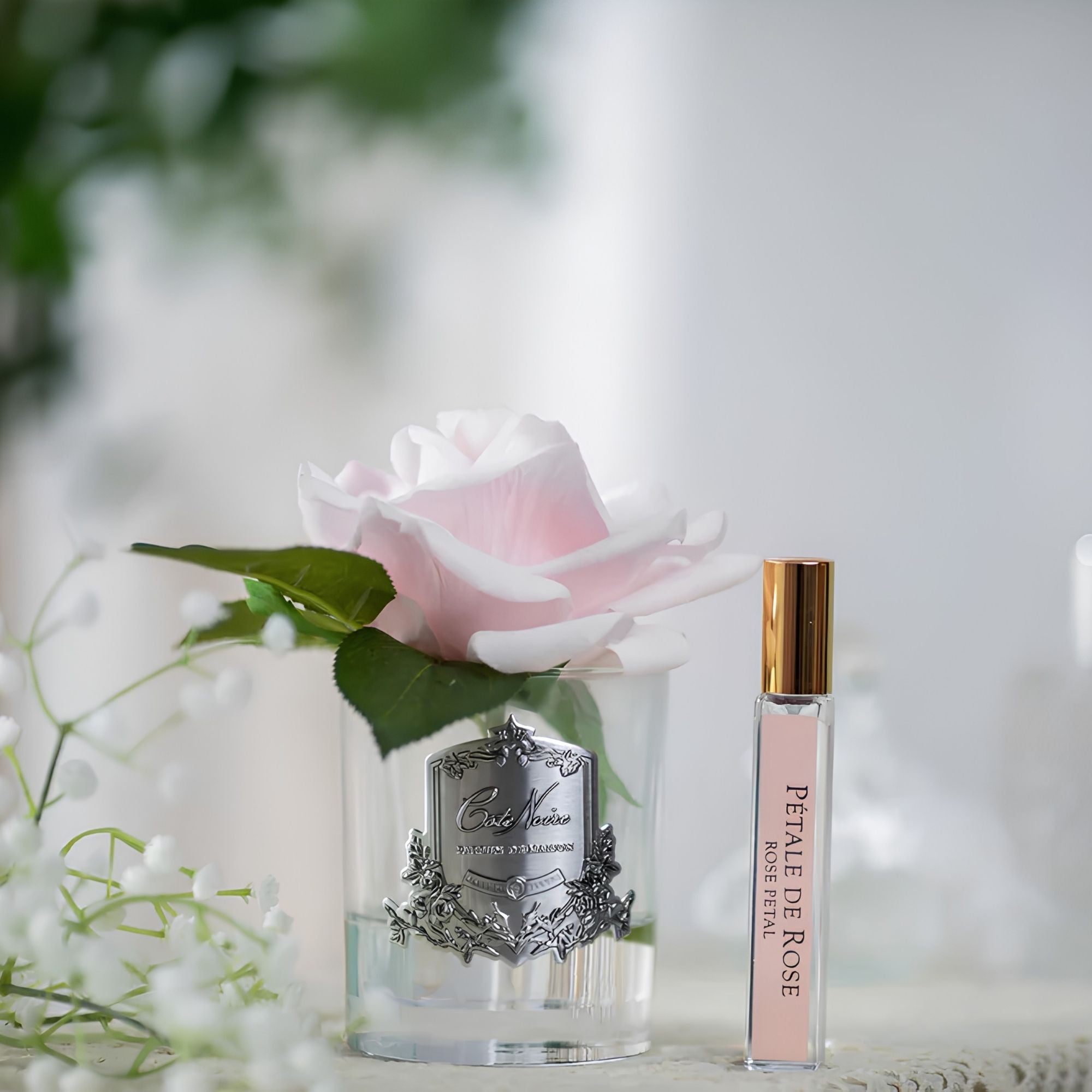 Close-up of Côte Noire Single French Rose petals in gel with silver crest detail