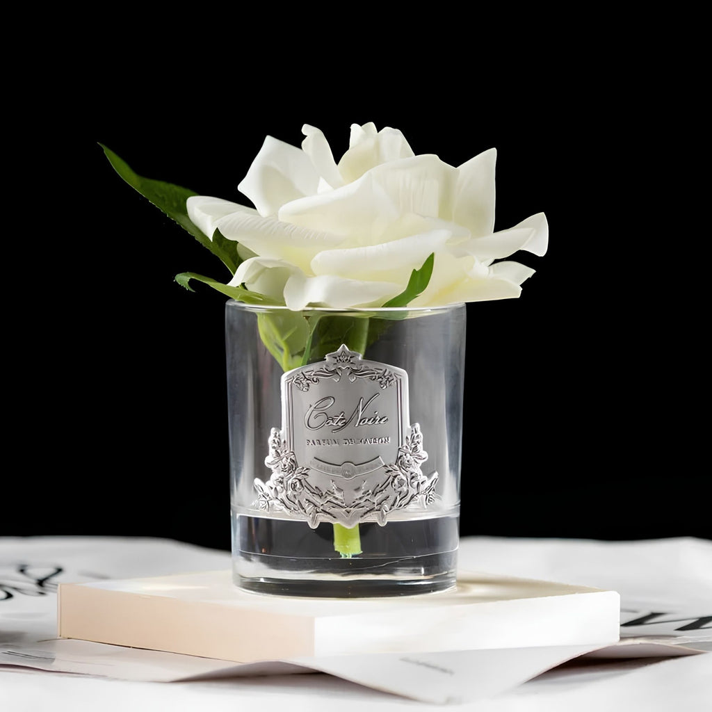 Close-up of Côte Noire Ivory White Single French Rose petals in gel with silver crest detail