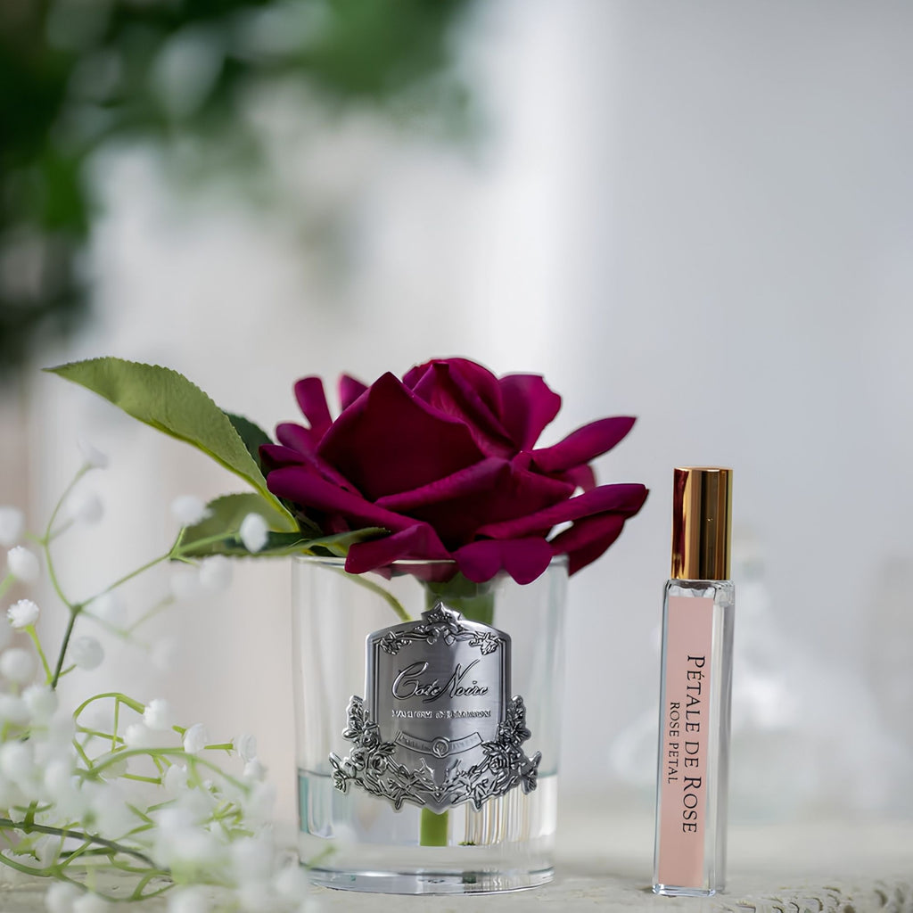 Close-up of Côte Noire Single French Rose red petals in gel inside clear glass