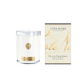 Côte Noire Jasmine Flower Tea Soy Candle in white vessel with gold badge and crystal lid