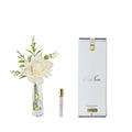Côte Noire Champagne Summer Rose in clear vase with gold badge