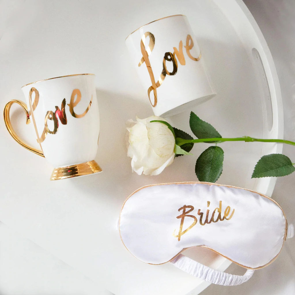 Bridal gift set with gold-accented mug, soy candle and eye mask
