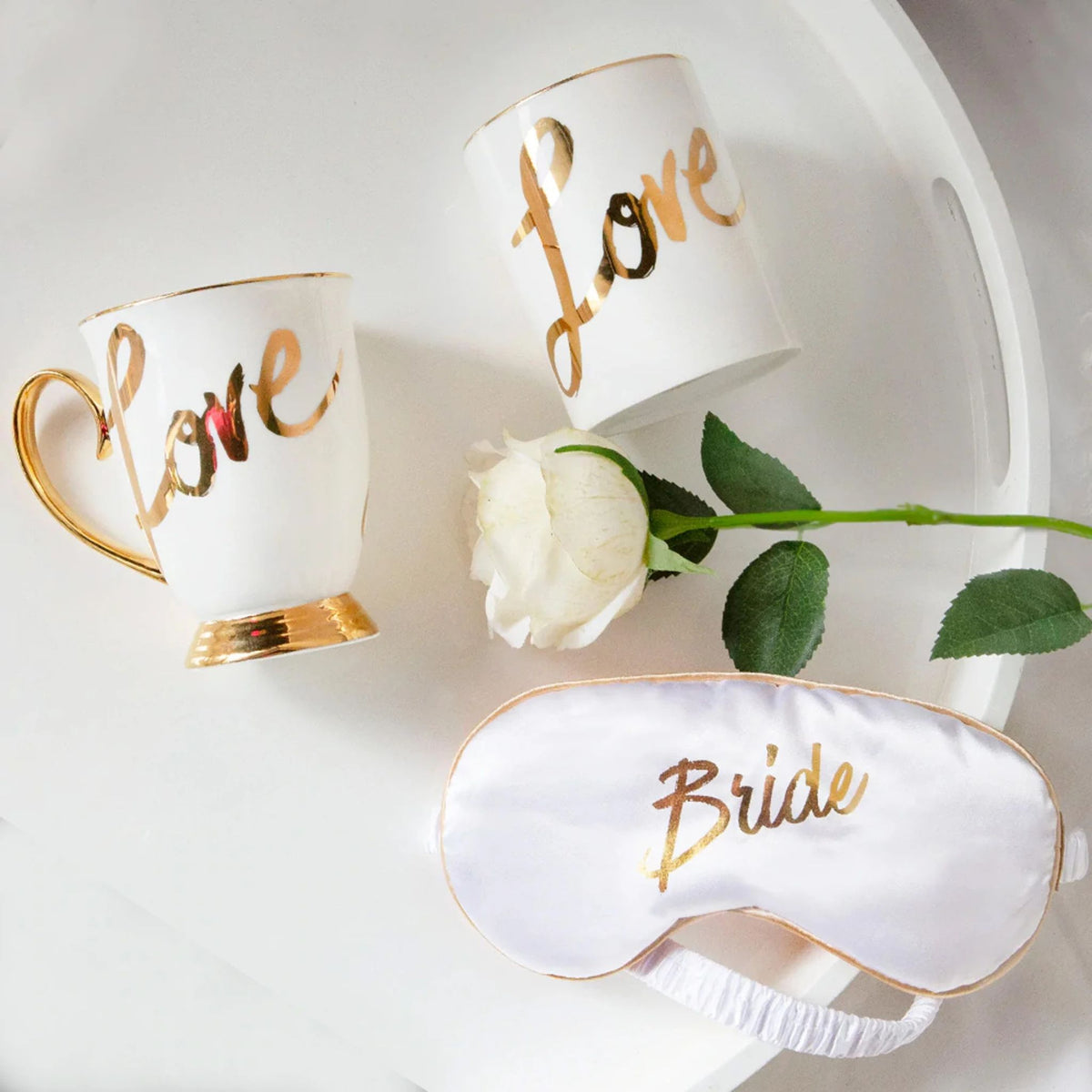 Bridal gift set with gold-accented mug, soy candle and eye mask