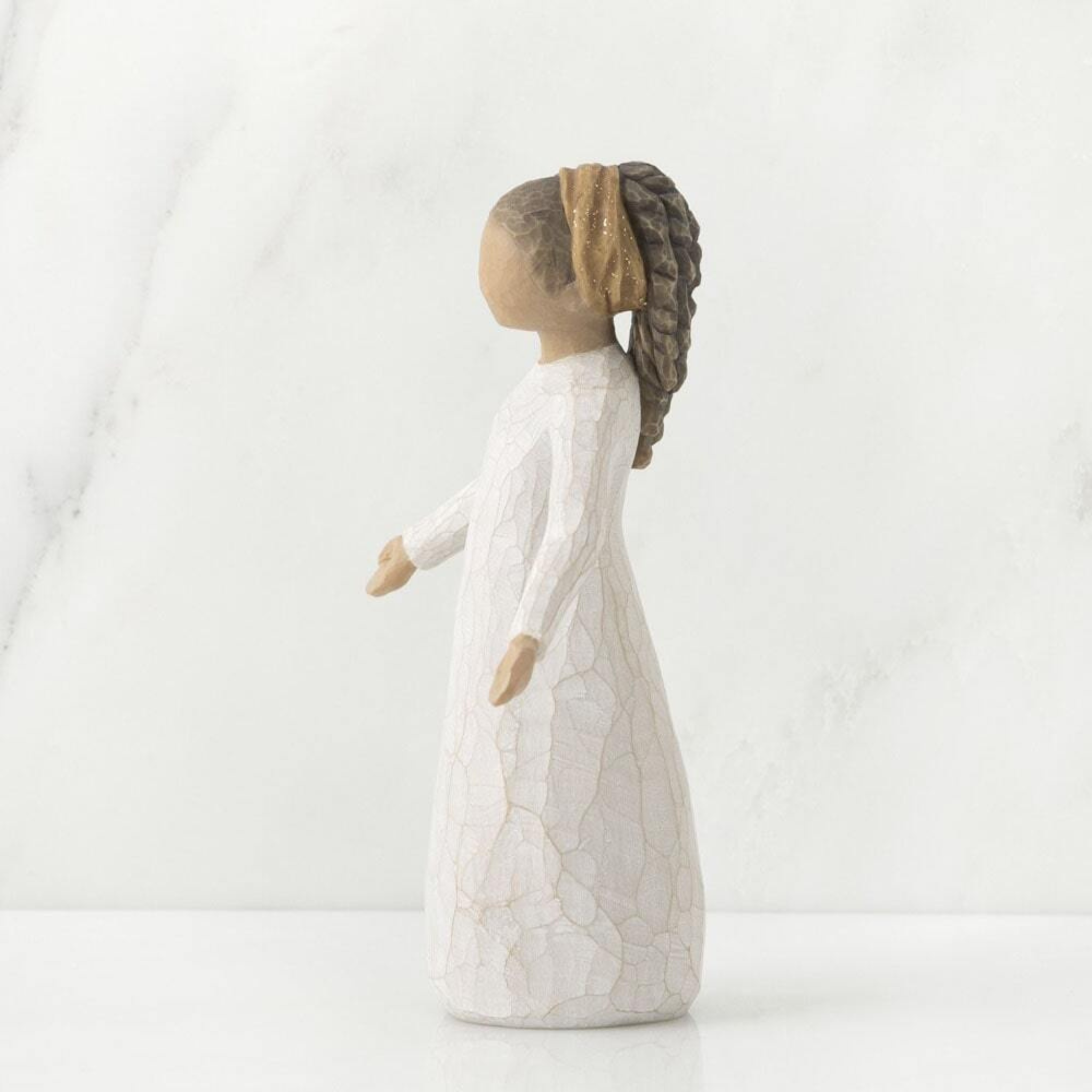 Close-up of Willow Tree Blessings figurine glitter headband detail